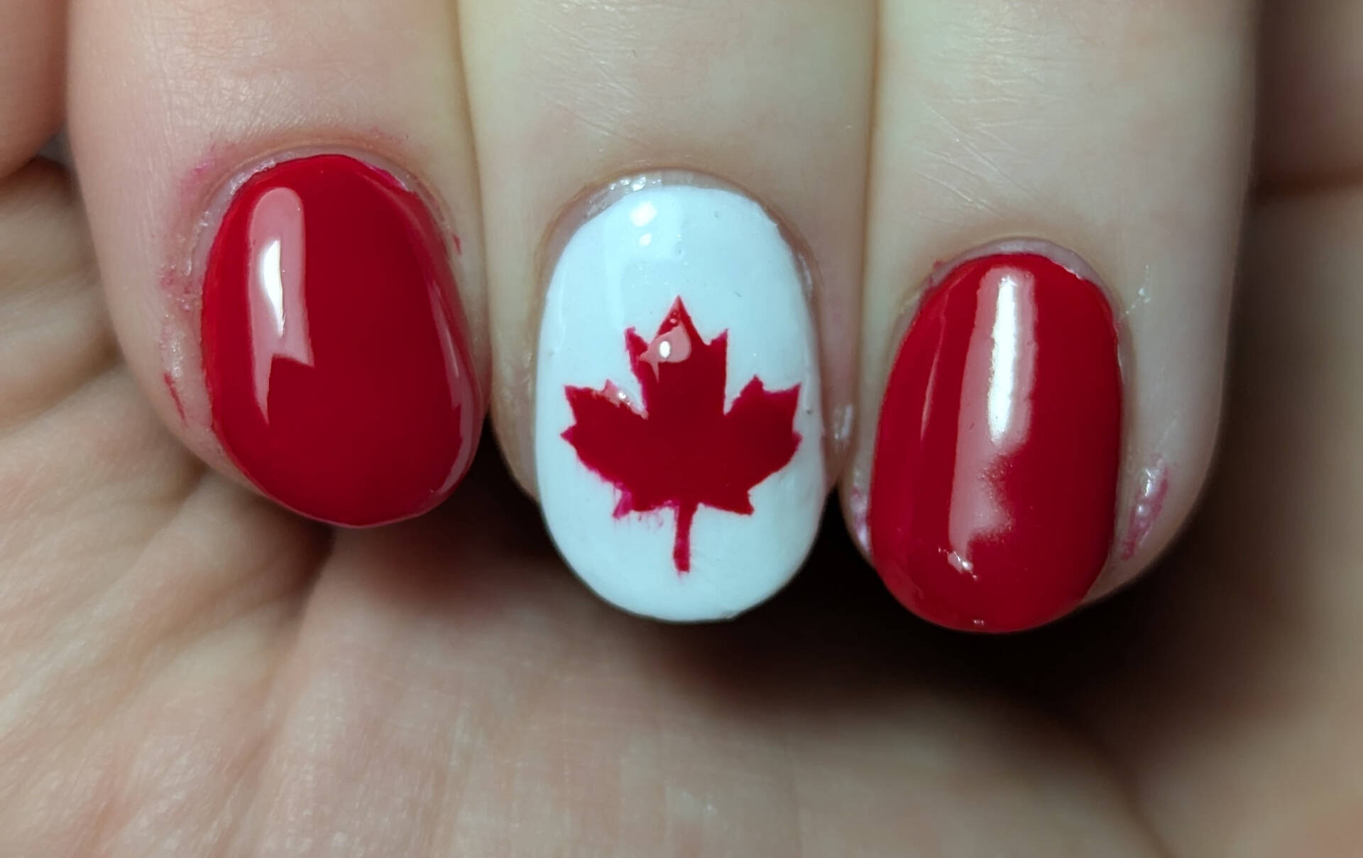 canada flag nails, posed like the flag
